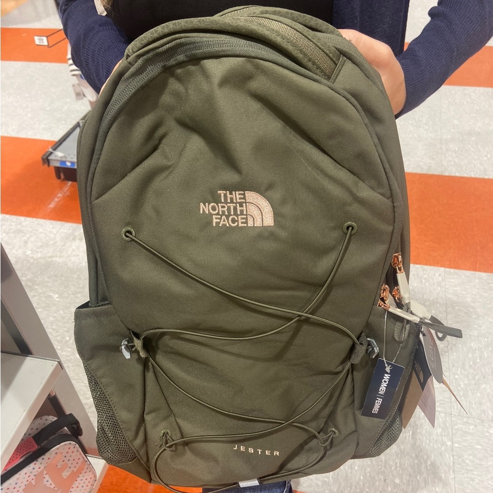 The North Face Olive Green Jester Luxe Backpack with rose gold accents